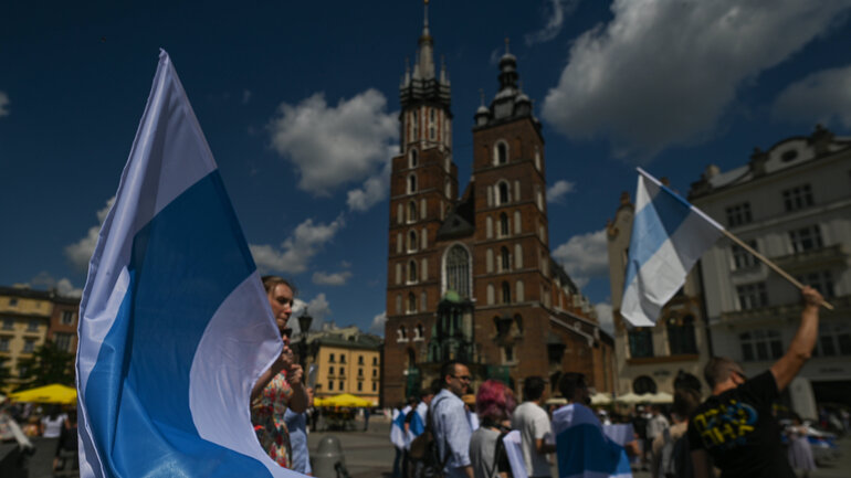 Members of the local Russian diaspora in Krakow join the global anti-war demonstration of all free Russians and protest against the war with Ukraine at the Adam Mickiewicz monument in the Main Square in Krakow, Poland.